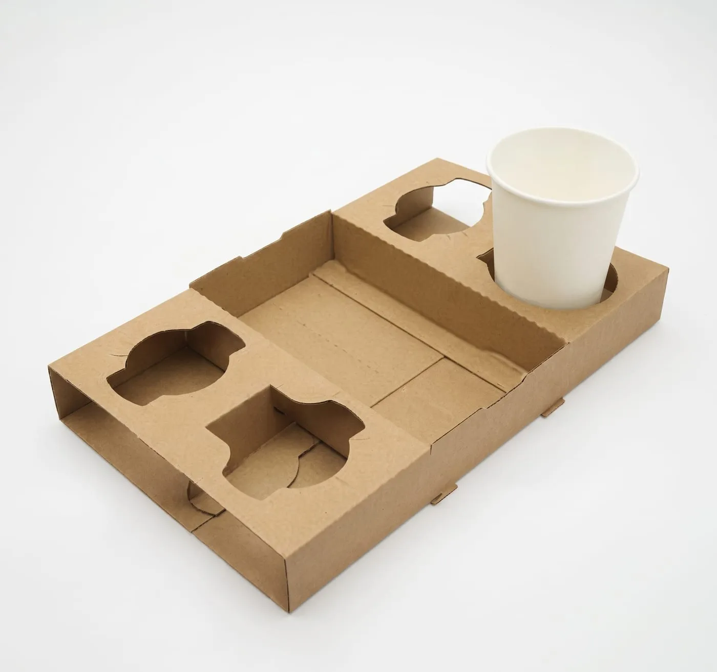 Kraft cup carrier holding a paper cup